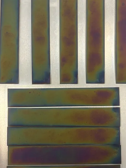 Heat-tinted metal coupons after thermal exposure