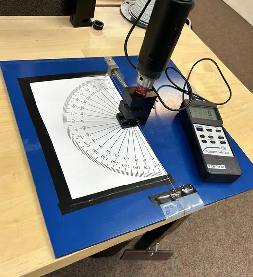 Wire stiffness measurement on a protractor jig with torque meter
